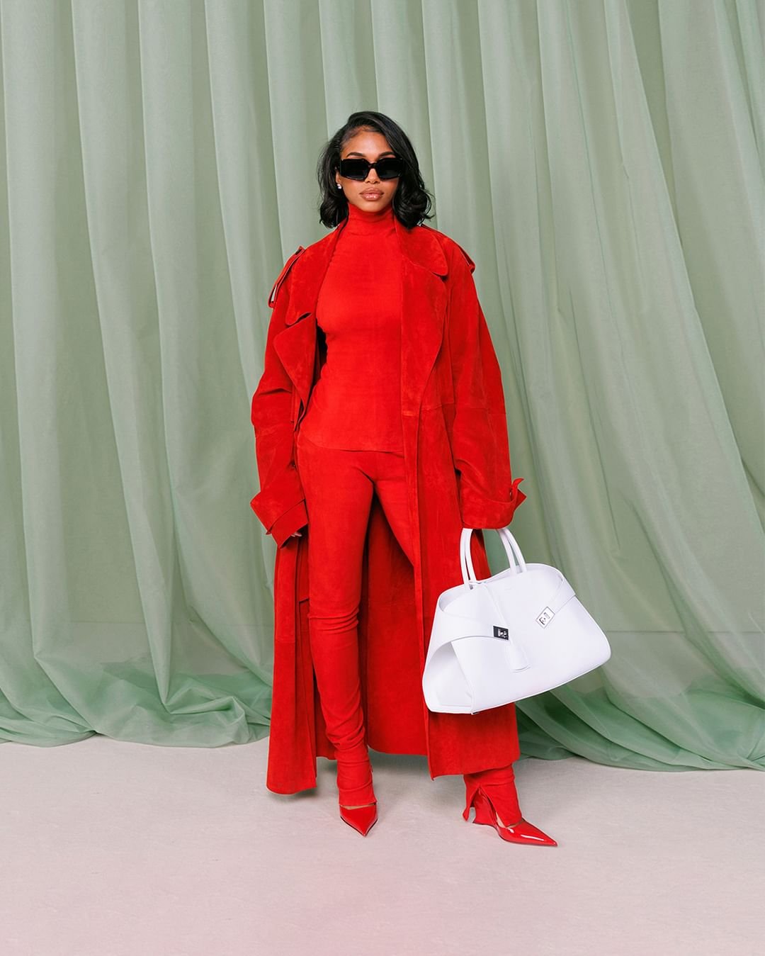 Lori harvey in ferragamo hug bag red